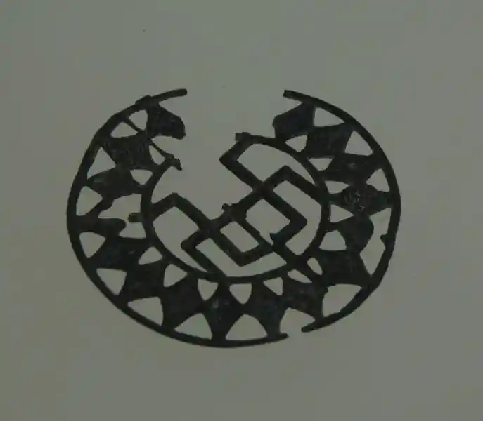 Swastika inside a metallic solar disc.